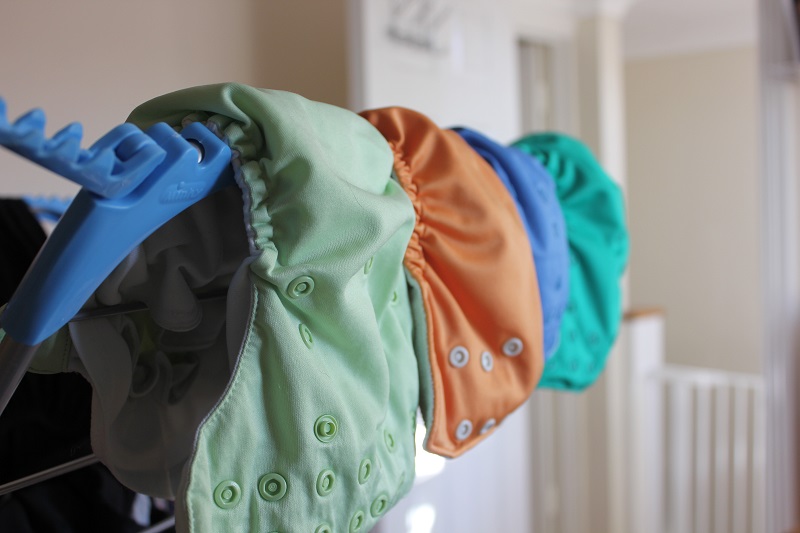 eco friendly reusable diapers hanging on drying ra NV9NGB7